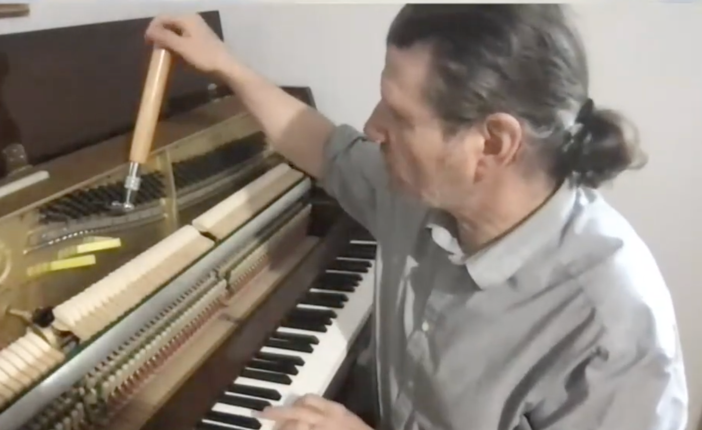 Mark Cerisano tuning a Yamaha piano